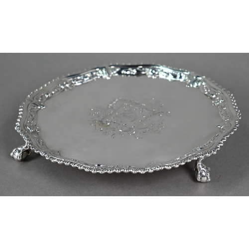 111 - An early George III silver card salver with gadrooned and floral-embossed rim, on claw and ball feet... 