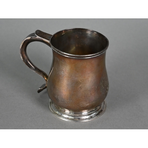 114 - A George II silver small baluster mug with scroll handle and moulded foot-rim, Richard Beale (probab... 