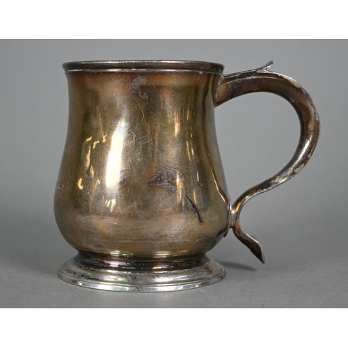 114 - A George II silver small baluster mug with scroll handle and moulded foot-rim, Richard Beale (probab... 