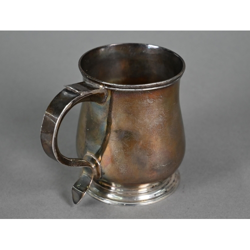 114 - A George II silver small baluster mug with scroll handle and moulded foot-rim, Richard Beale (probab... 