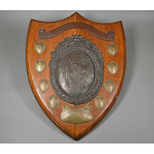 135 - A large oak trophy shield for the Aberdare Quoit Association, with central copper plaque embossed wi... 