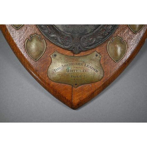 135 - A large oak trophy shield for the Aberdare Quoit Association, with central copper plaque embossed wi... 