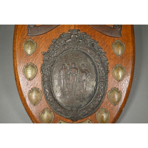 135 - A large oak trophy shield for the Aberdare Quoit Association, with central copper plaque embossed wi... 