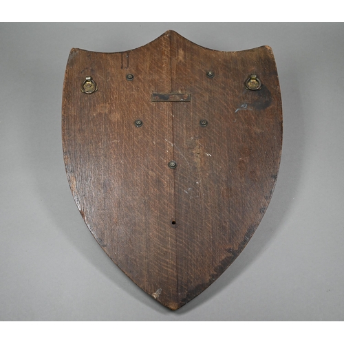 135 - A large oak trophy shield for the Aberdare Quoit Association, with central copper plaque embossed wi... 