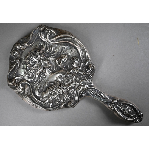 142 - An Edwardian Art Nouveau silver hairbrush and hand-mirror, moulded in bas relief with Ophelia in pro... 