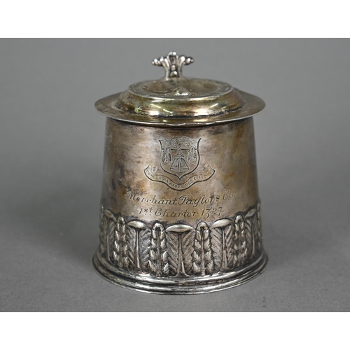 146 - A silver miniature replica tankard with embossed and chased decoration, distributed by the Merchant ... 