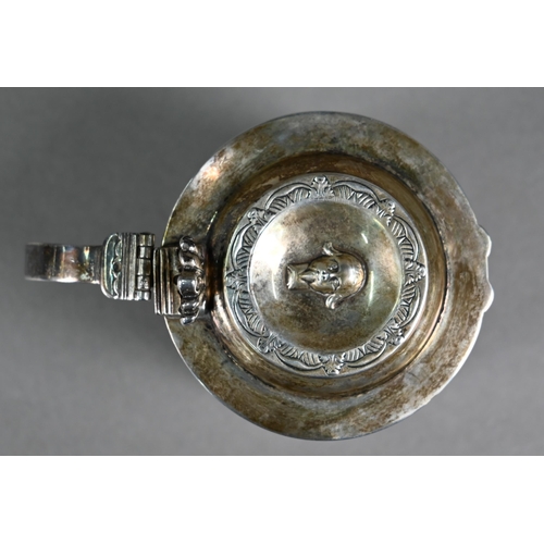 146 - A silver miniature replica tankard with embossed and chased decoration, distributed by the Merchant ... 