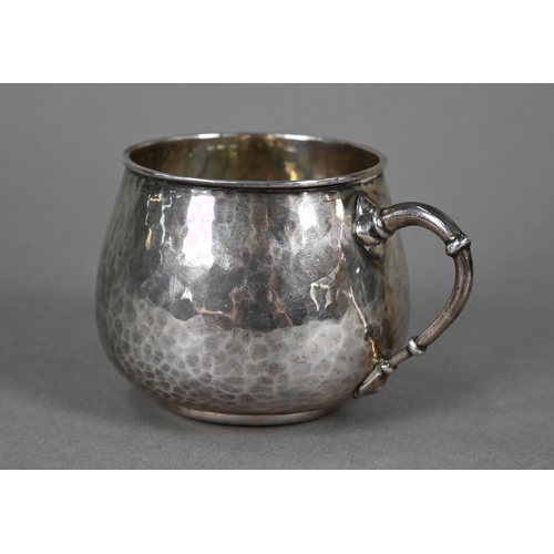 147 - Liberty & Co.  A planished silver pot-bellied Christening mug with knopped loop handle, Birmingh... 