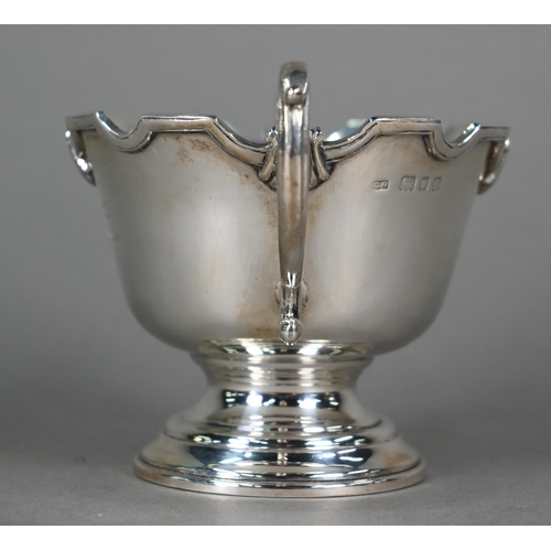 158 - A pair of silver bonbon bowls with twin scroll handles, on stemmed bases, Charles Boyton, London 193... 