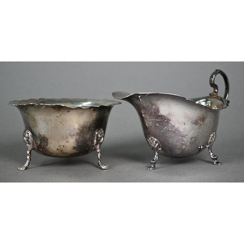 164 - An Edwardian silver sugar basin with cut rim and pad feet, Birmingham 1906, to/w a somewhat similar ... 