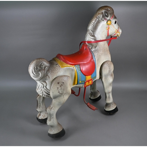 165 - A 1950s Mobo Bronco toy horse, the painted pressed steel body complete with red plastic reins and wo... 