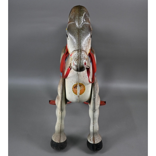 165 - A 1950s Mobo Bronco toy horse, the painted pressed steel body complete with red plastic reins and wo... 