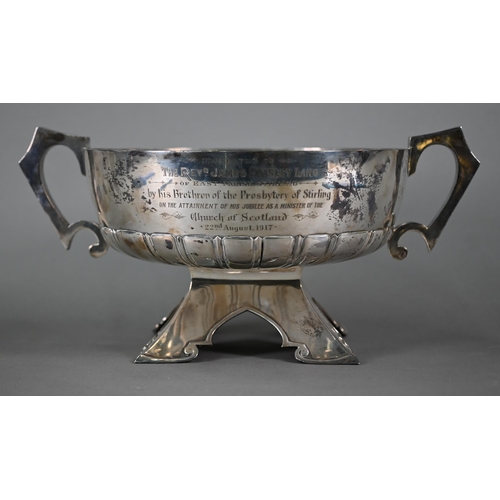 166 - A large silver rose bowl with scroll handles and half-reeded body, on substantial bracket foot in th... 