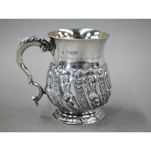 167 - A late Victorian heavy quality silver Christening mug with scroll handle and chased and writhen deco... 