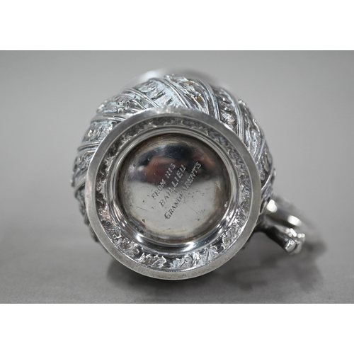 167 - A late Victorian heavy quality silver Christening mug with scroll handle and chased and writhen deco... 