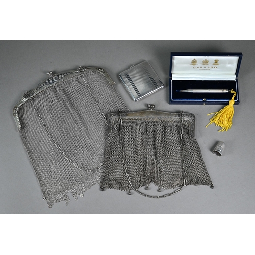 174 - A silver mesh evening bag, London import 1913, to/w a Portuguese .833 standard example; lot also inc... 