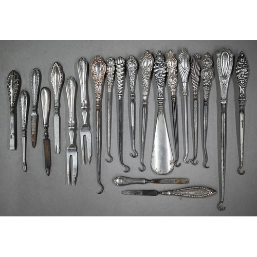 176 - A collection of silver-handled button-hooks, to/w tea knives, nail-buffers, matchbox covers, etc.