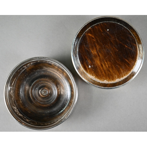 183 - A pair of .800 grade coasters with vine-embossed sides and turned wood bases, 10cm diameter, to/w an... 