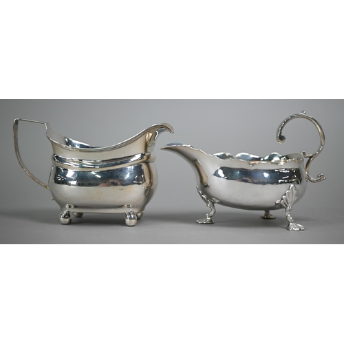 191 - A mid Georgian silver pot-bellied sauce-boat with cut rim, scroll handle and shell feet, engraved ba... 