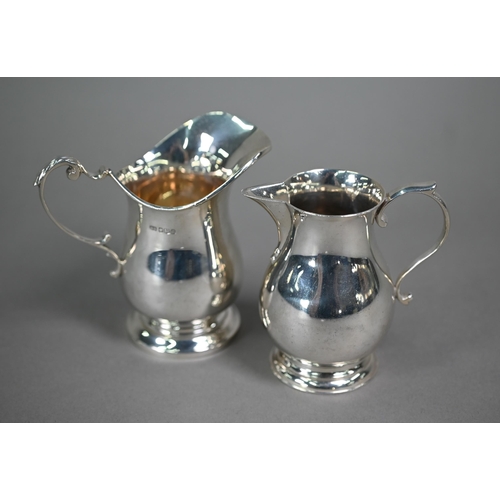 193 - A silver sparrow-beak cream jug in the Georgian manner, with scroll handle and moulded foot, D&J... 