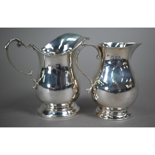 193 - A silver sparrow-beak cream jug in the Georgian manner, with scroll handle and moulded foot, D&J... 