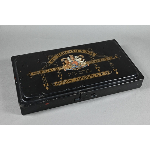 205 - An Edwardian artist's black japanned watercolour box, the hinged lid with gilded coat of arms and ma... 