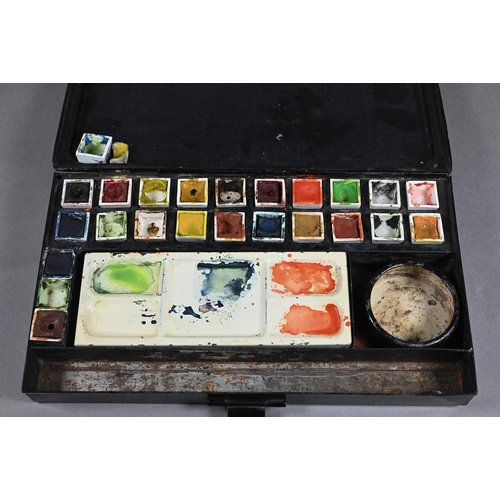 205 - An Edwardian artist's black japanned watercolour box, the hinged lid with gilded coat of arms and ma... 