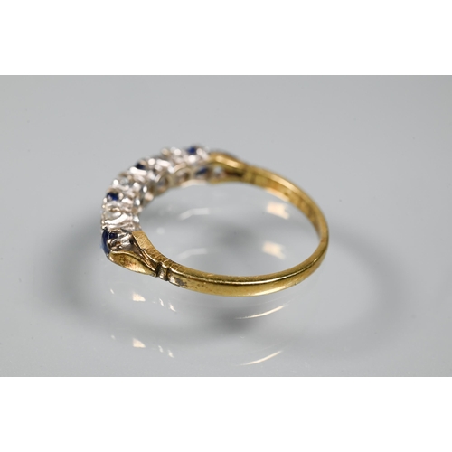 206 - An 18ct yellow gold ring set with three oval blue sapphires with two diamonds between, size P to/w a... 