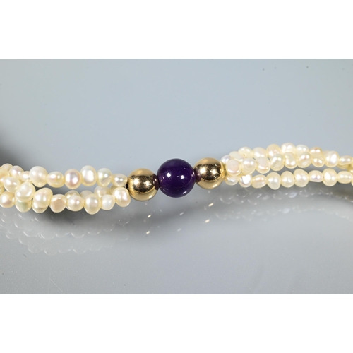 209 - A pearl necklace comprising a triple row of river pearls with hardstone beads and heart to centre, w... 