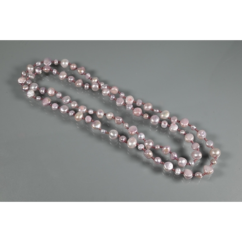 218 - Two Baroque pearl necklaces, one white 50 cm long, the other pink, 45 cm (closed), both knotted thro... 