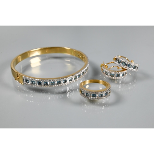 219 - A diamond and blue topaz suite comprising half-hinged bangle with alternate channel-set diamonds and... 