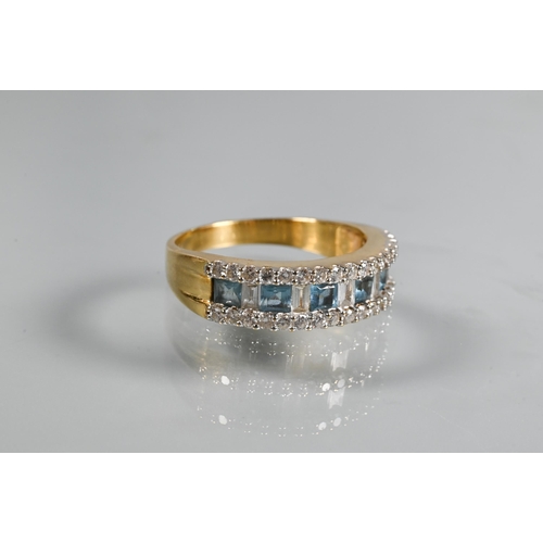 219 - A diamond and blue topaz suite comprising half-hinged bangle with alternate channel-set diamonds and... 