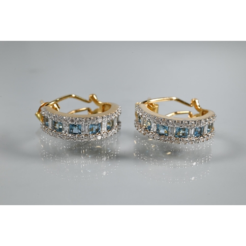 219 - A diamond and blue topaz suite comprising half-hinged bangle with alternate channel-set diamonds and... 