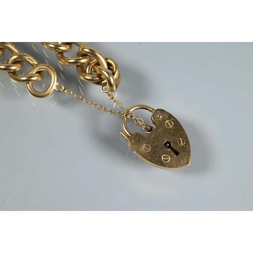 222 - A 9ct yellow gold curb bracelet with padlock and safety chain attached, approx 42.7g