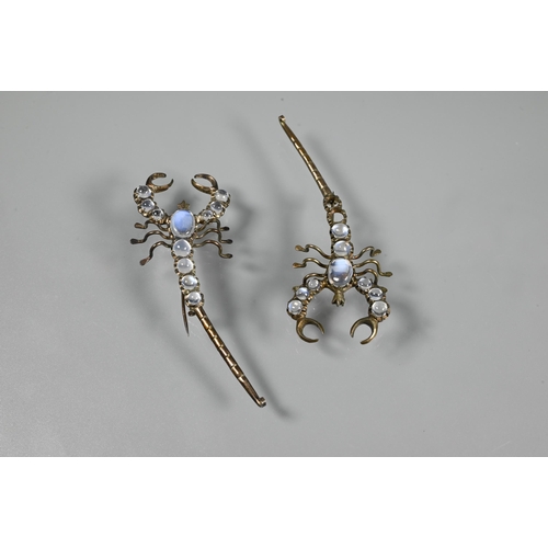 227 - A pair of brooches in the form of moonstone-set scorpions, each with graduated cabochon moonstones t... 