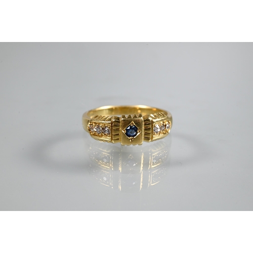 234 - An antique 18ct yellow gold ring set with blue sapphire to centre, with three diamonds to each shoul... 