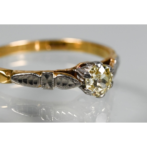 239 - A single stone diamond ring, the claw set diamond of pale yellow hue in 18ct yellow and white gold s... 