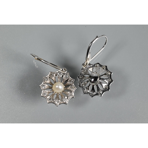 240 - A pair of drop earrings for pierced ears, the open daisy cluster with pearl to the centre and diamon... 