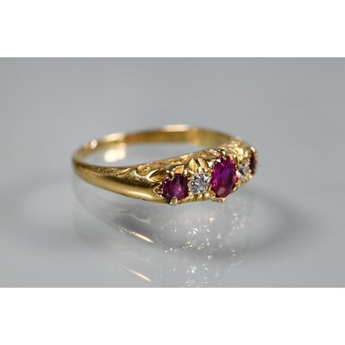 241 - An antique five stone ruby and diamond ring, the graduated stones in 18ct yellow gold setting, size ... 