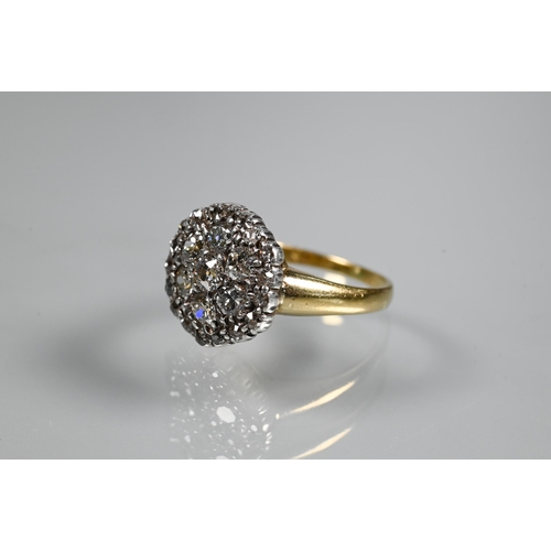 243 - A diamond cluster ring, the central daisy cluster with border around, 18ct yellow and white gold set... 