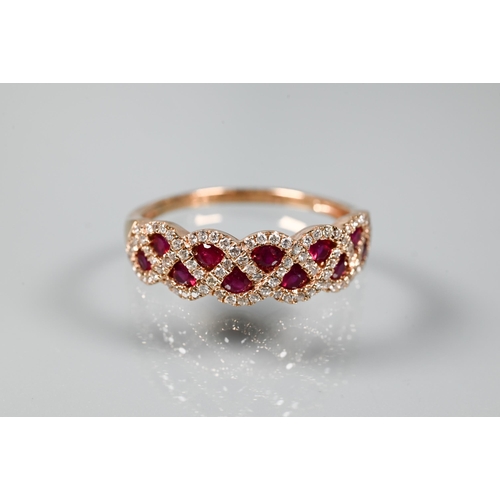 249 - A ring and earring suite stamped 'Royal', with ruby and diamond lattice-work design, rose metal set ... 