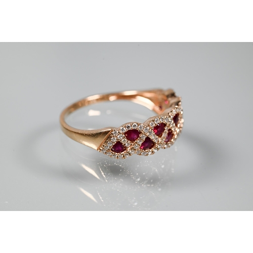 249 - A ring and earring suite stamped 'Royal', with ruby and diamond lattice-work design, rose metal set ... 