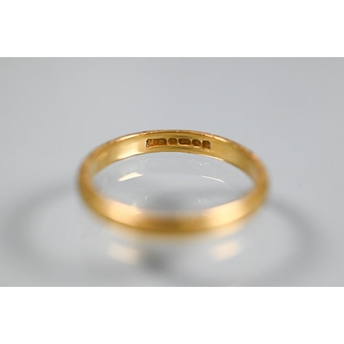 251 - A 22ct yellow gold wedding band with engraved edge, size M, approx 3.2g