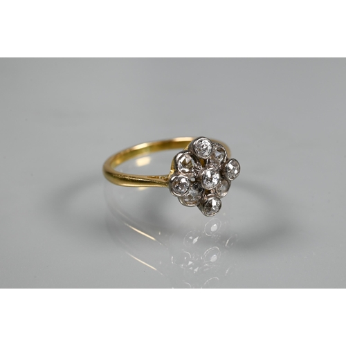 254 - An antique diamond cluster ring formed of nine mixed cut diamonds, yellow and white gold set, size M