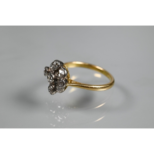 254 - An antique diamond cluster ring formed of nine mixed cut diamonds, yellow and white gold set, size M