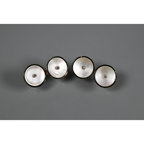 257 - A cased pair of 18ct yellow gold chain-linked cufflinks set mother of pearl with enamel border and d... 