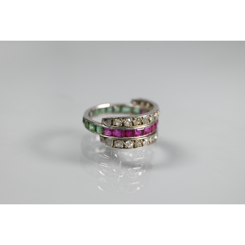 261 - A trio 'Day/Night' ring, white metal set with channel set diamonds, rubies and emeralds, size M