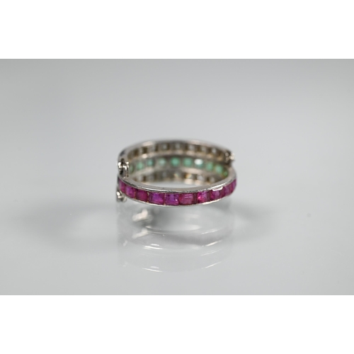 261 - A trio 'Day/Night' ring, white metal set with channel set diamonds, rubies and emeralds, size M