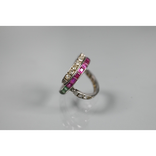 261 - A trio 'Day/Night' ring, white metal set with channel set diamonds, rubies and emeralds, size M