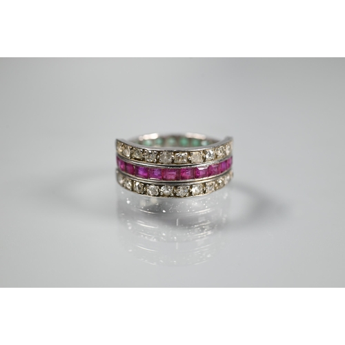 261 - A trio 'Day/Night' ring, white metal set with channel set diamonds, rubies and emeralds, size M